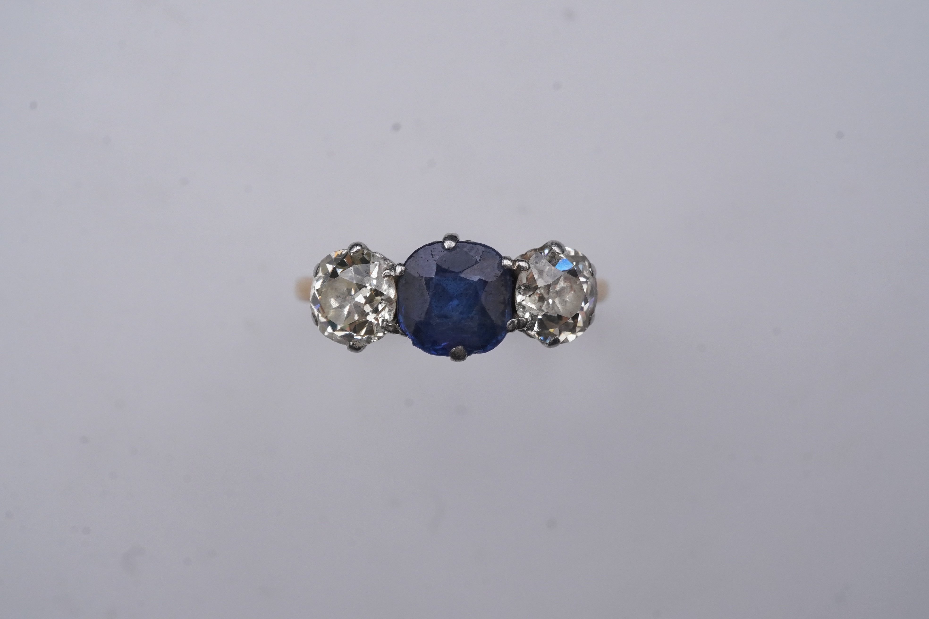 A sapphire and diamond three-stone ring, early 20th century